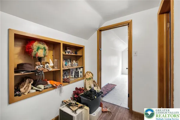 a room with furniture and wooden floor