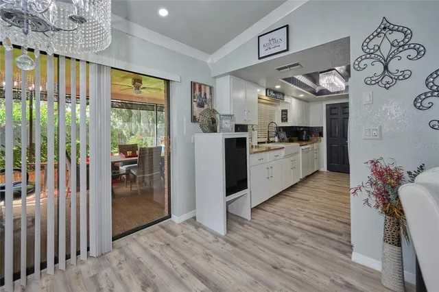 a large kitchen with stainless steel appliances kitchen island granite countertop a stove top oven a sink and dishwasher