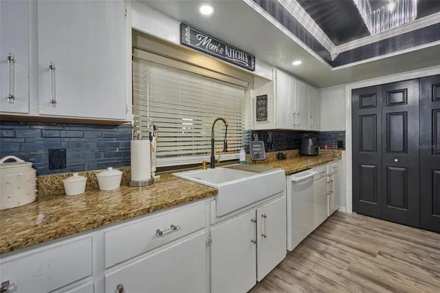 a kitchen with a stove and a sink