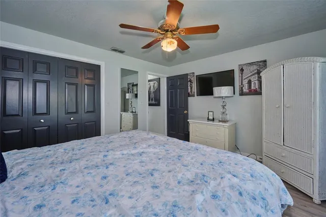 a spacious bathroom with a granite countertop sink and a mirror