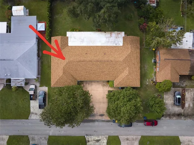 an aerial view of residential house with outdoor space and swimming pool