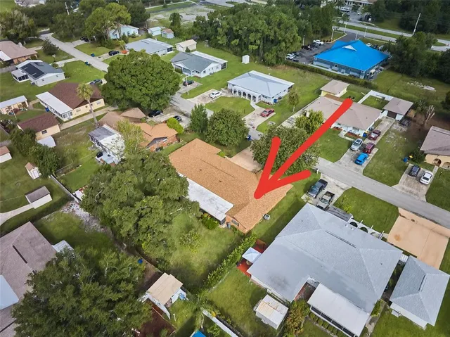 an aerial view of residential houses with outdoor space