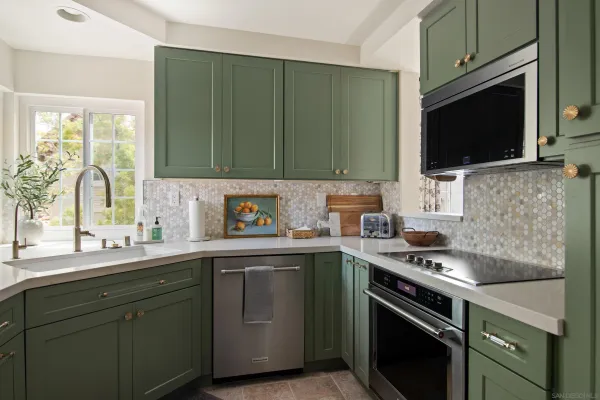 a kitchen with a sink stove and microwave
