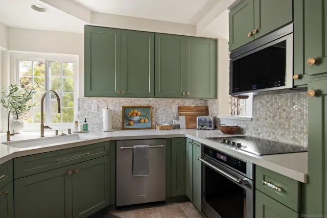 a kitchen with a sink stove and microwave