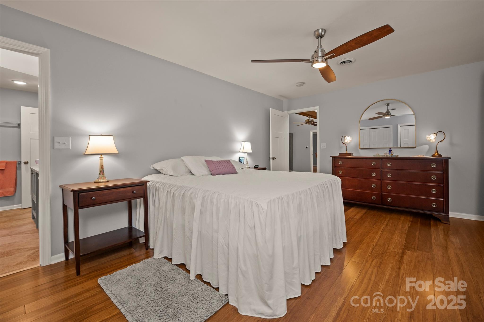 44 Jervey Road, Unit 3A Tryon, NC 28782 - Photo 21 of 29 a bedroom with a bed and a chandelier