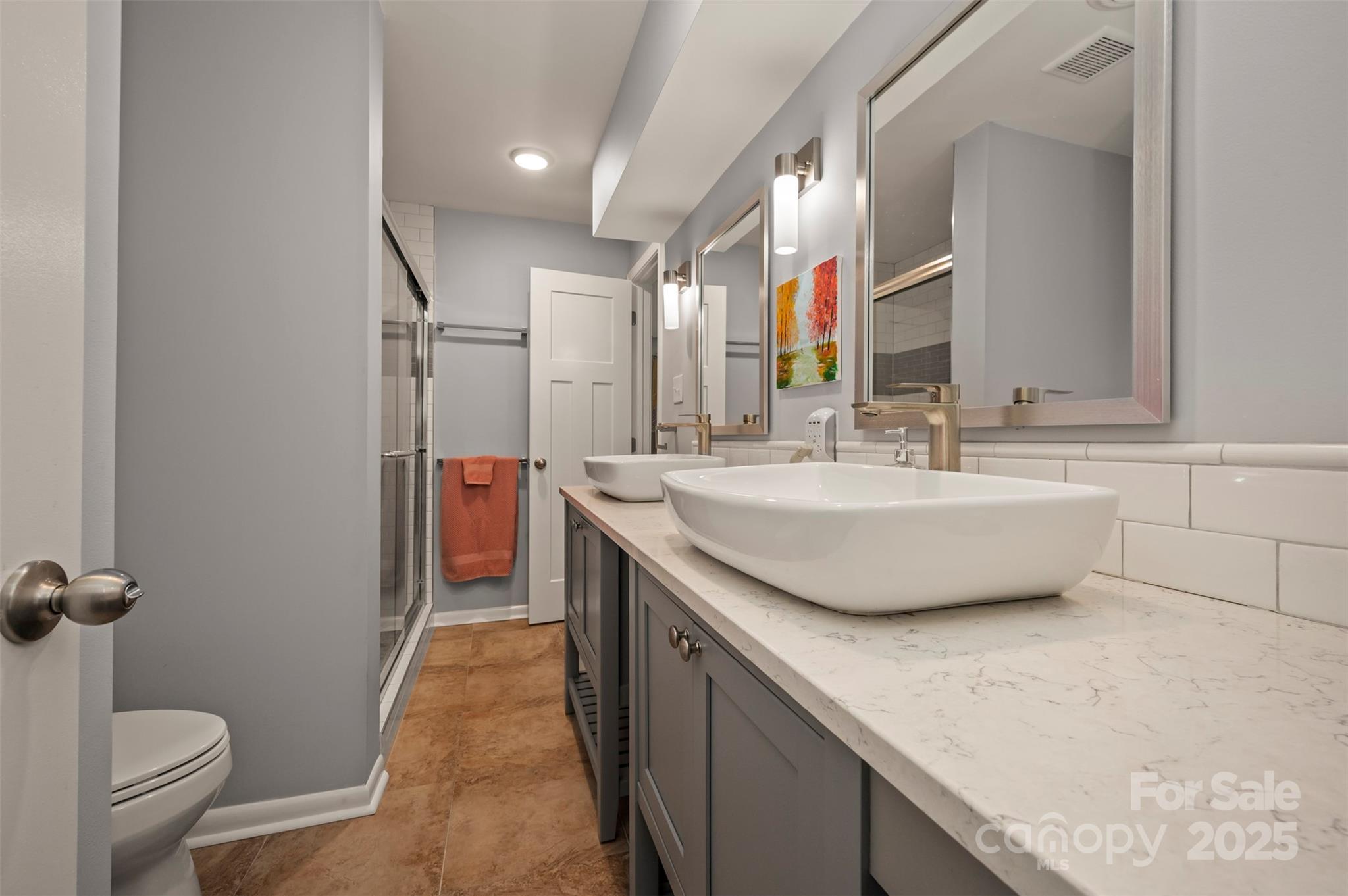 44 Jervey Road, Unit 3A Tryon, NC 28782 - Photo 23 of 29 a bathroom with a double vanity sink and a mirror
