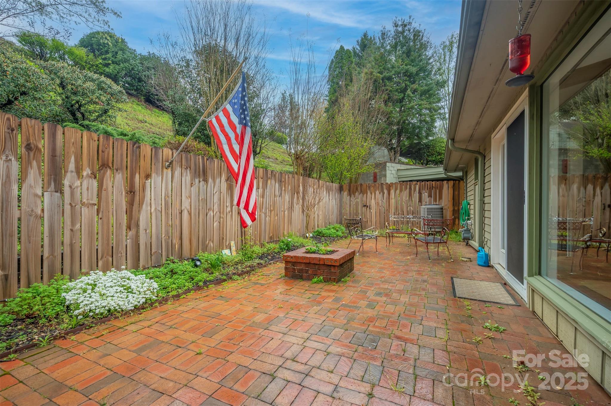 44 Jervey Road, Unit 3A Tryon, NC 28782 - Photo 27 of 29 a backyard of a house with chairs and plants