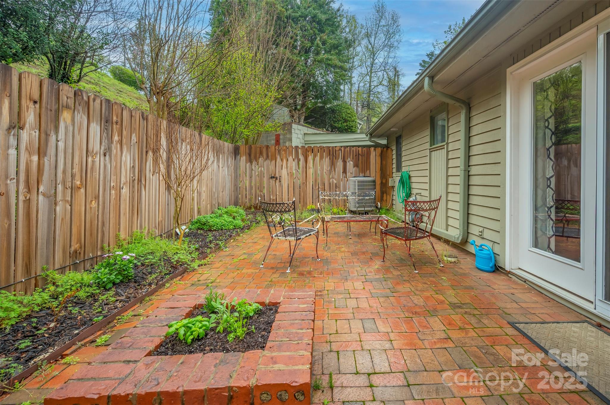 44 Jervey Road, Unit 3A Tryon, NC 28782 - Photo 28 of 29 a view of patio with table and chairs and potted plants