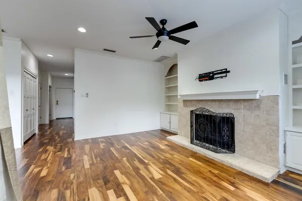 a view of livingroom with hardwood floor and a ceiling fan