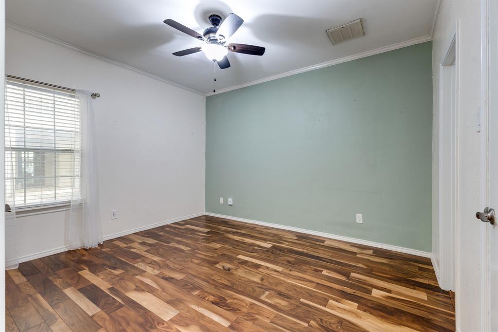 5310 Keller Springs Road, Unit 413 Dallas, TX 75248 - Photo 15 of 20 an empty room with a window and a ceiling fan