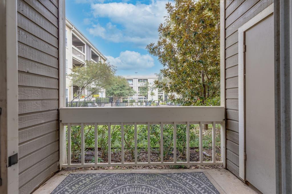 5310 Keller Springs Road, Unit 413 Dallas, TX 75248 - Photo 19 of 20 a view of a room with a large window and front view of a house