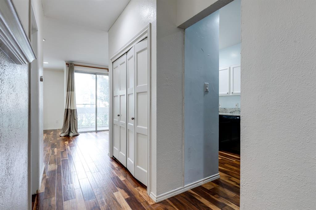 5310 Keller Springs Road, Unit 413 Dallas, TX 75248 - Photo 3 of 20 a view of a hallway with wooden floor and staircase