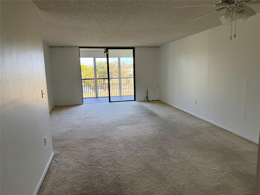 3650 Environ Boulevard, Unit 308 Lauderhill, FL 33319 - Photo 2 of 14 an empty room with a empty space and windows