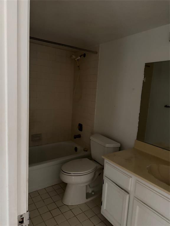 3650 Environ Boulevard, Unit 308 Lauderhill, FL 33319 - Photo 4 of 14 a white toilet sitting next to a bath tub and a shower