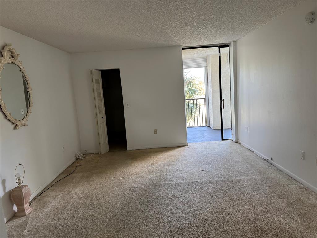 3650 Environ Boulevard, Unit 308 Lauderhill, FL 33319 - Photo 6 of 14 an empty room with windows
