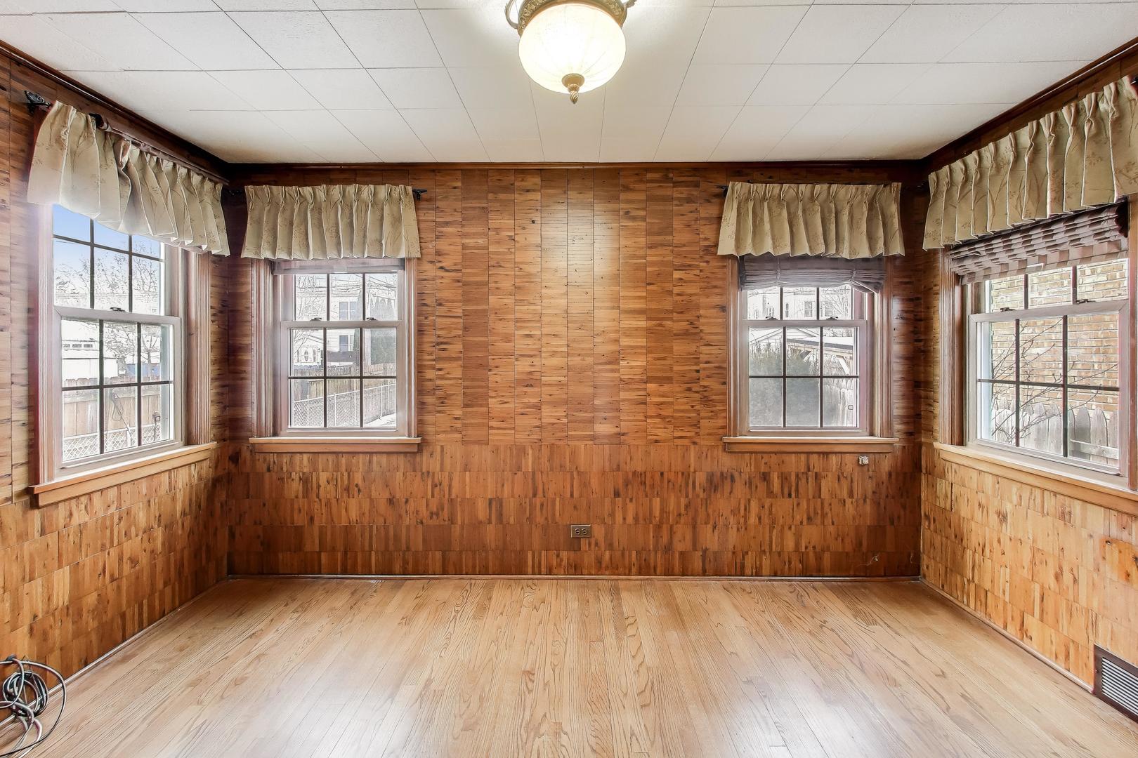 6230 North Troy Street Chicago, IL 60659 - Photo 13 of 38 wooden floor in an empty room with a window