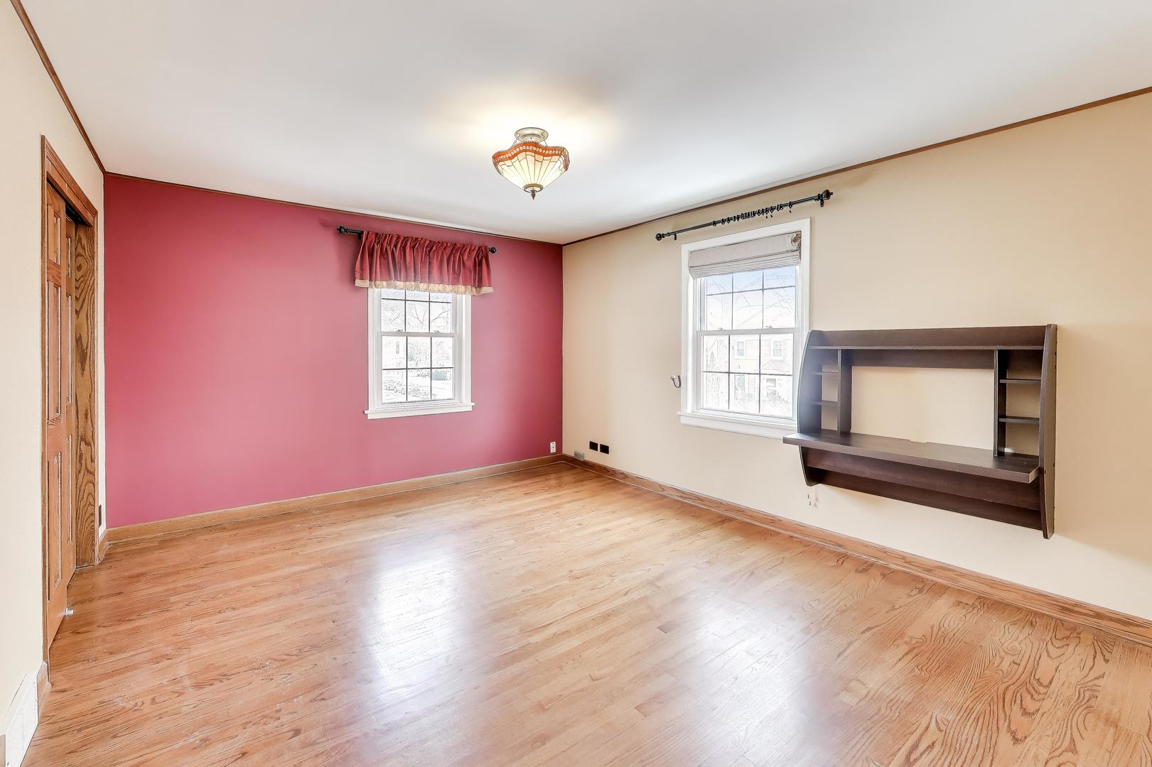 6230 North Troy Street Chicago, IL 60659 - Photo 18 of 38 a view of empty room with wooden floor and fan