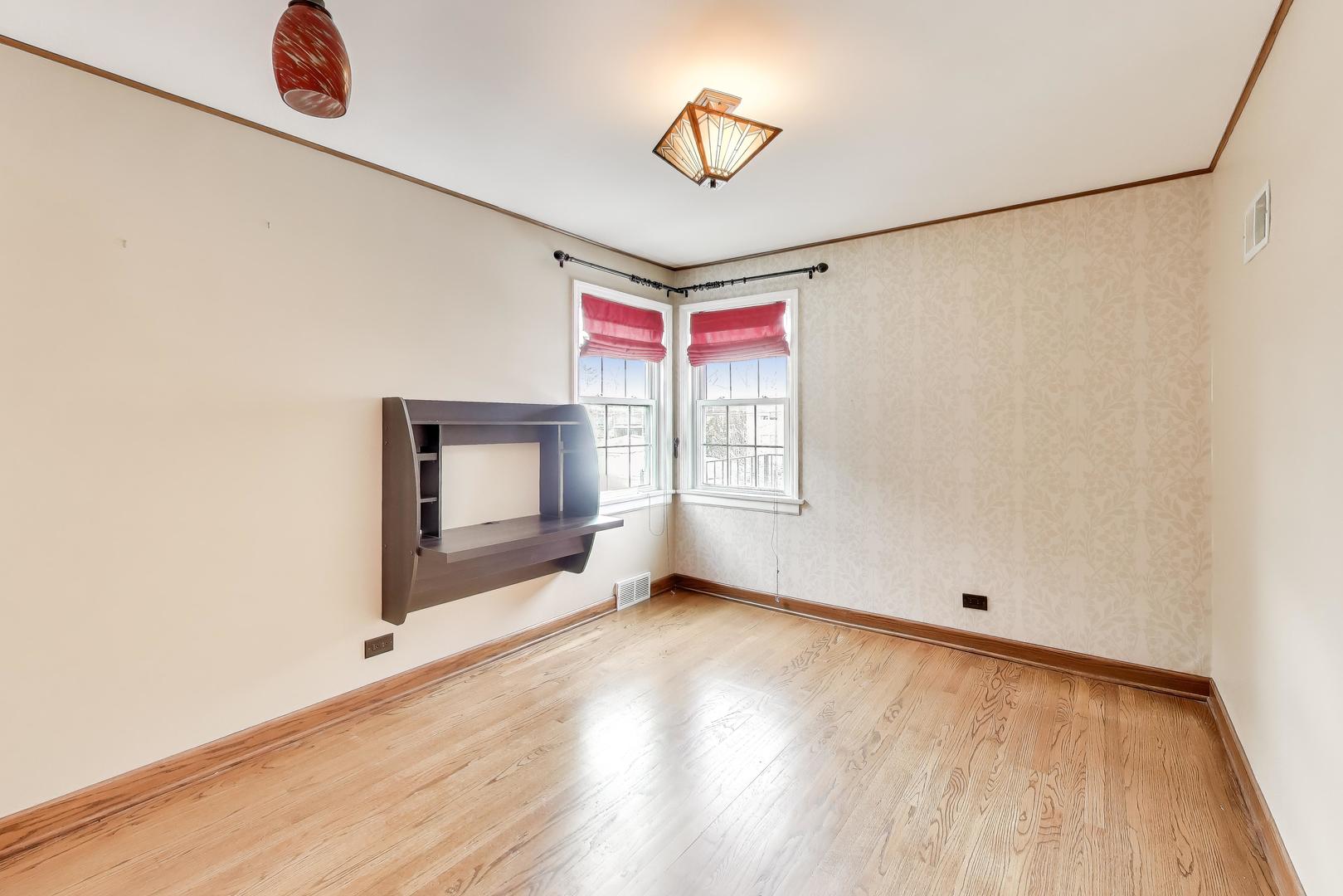 6230 North Troy Street Chicago, IL 60659 - Photo 20 of 38 a view of an empty room with a window