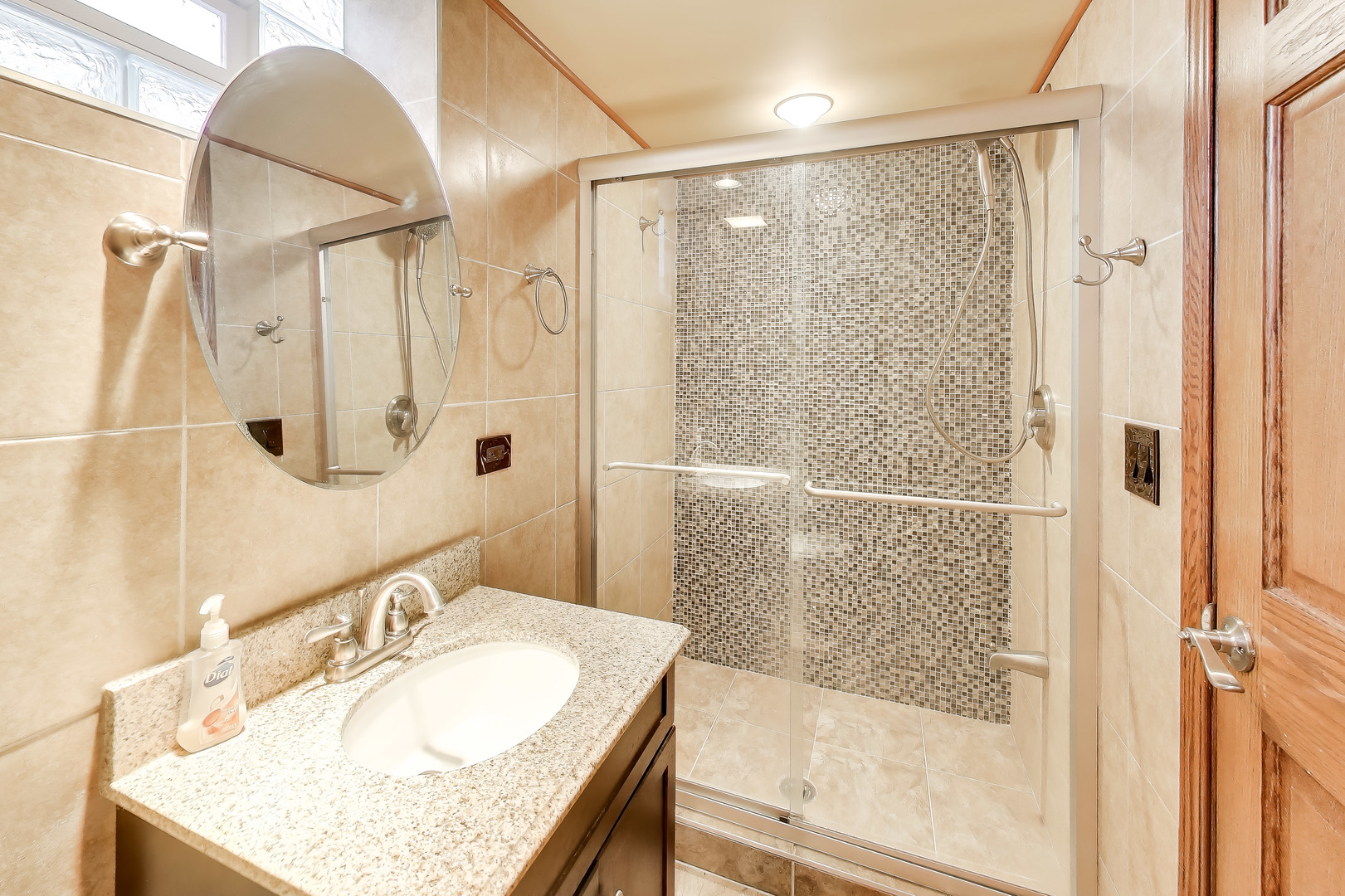 6230 North Troy Street Chicago, IL 60659 - Photo 28 of 38 a bathroom with a granite countertop sink mirror and shower