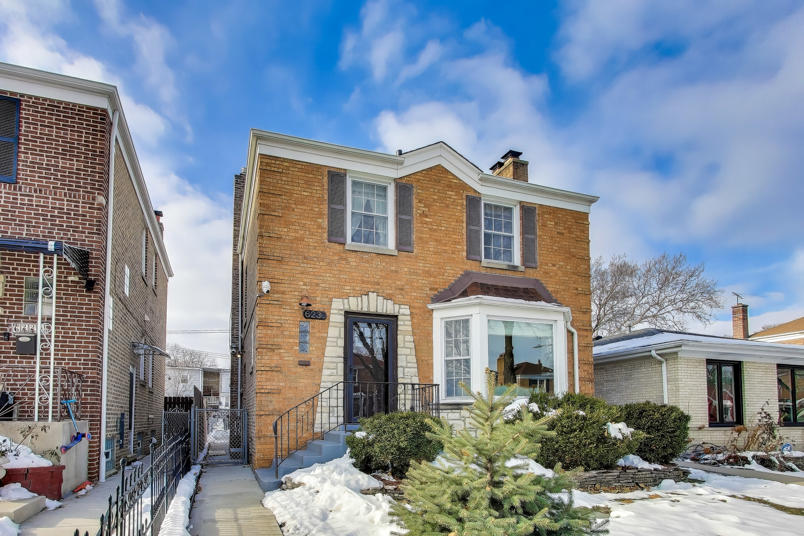 6230 North Troy Street Chicago, IL 60659 - Photo 3 of 38 a front view of a house with a yard