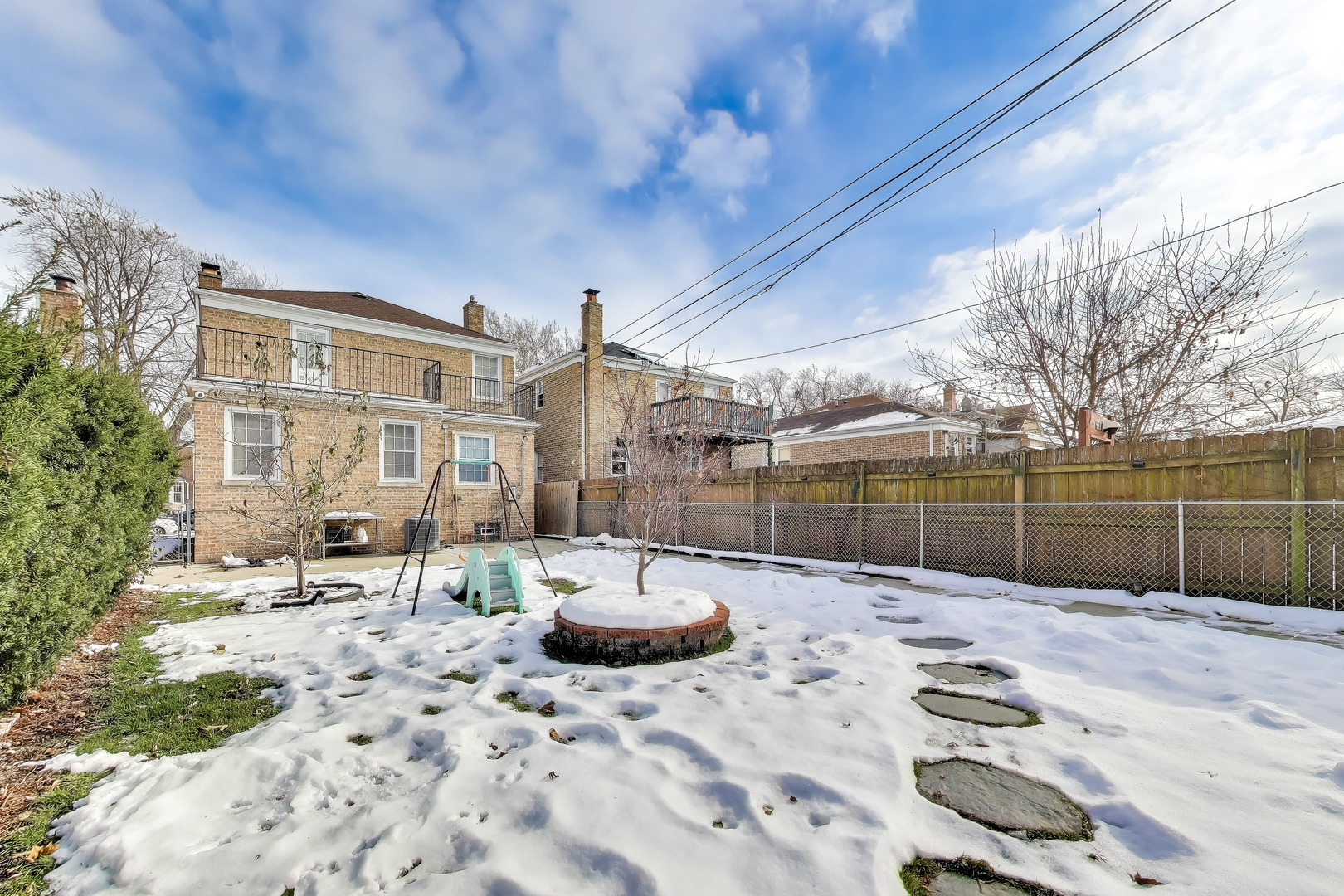 6230 North Troy Street Chicago, IL 60659 - Photo 34 of 38 a view of backyard with swimming pool and seating