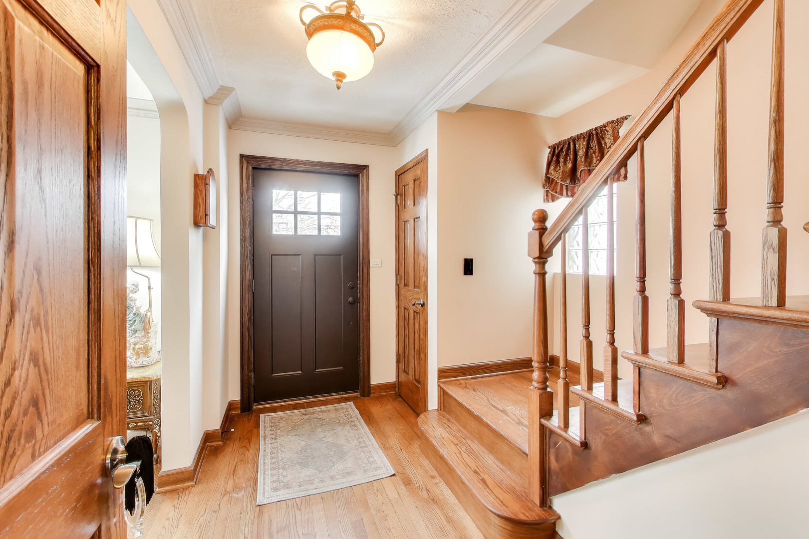 6230 North Troy Street Chicago, IL 60659 - Photo 4 of 38 a very nice looking room with a large window and a chandelier