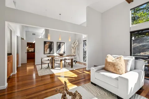 a living room with furniture and a table