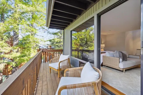 a spacious bathroom with a granite countertop sink and a mirror
