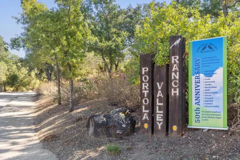 a view of a room with wooden floor and outdoor seating