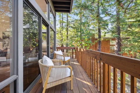 a view of balcony with furniture