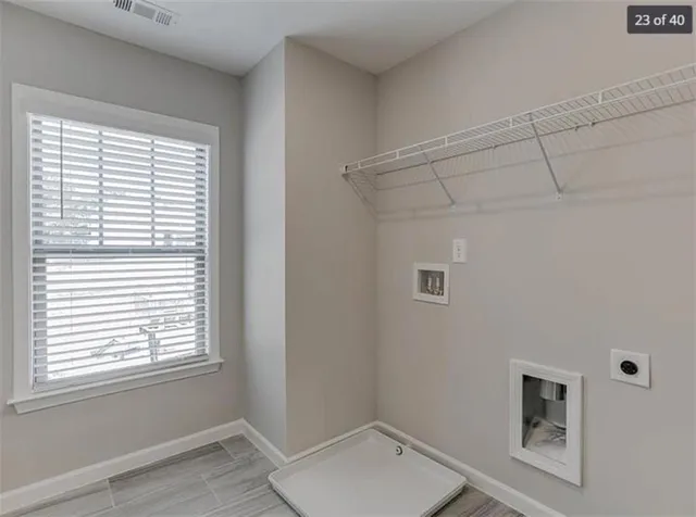a bathroom with a toilet and a window