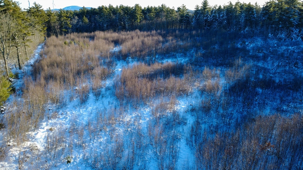 Lot 6 Suffolk Lane Gardner, MA 01440 - Photo 4 of 9 a view of a lake with green field