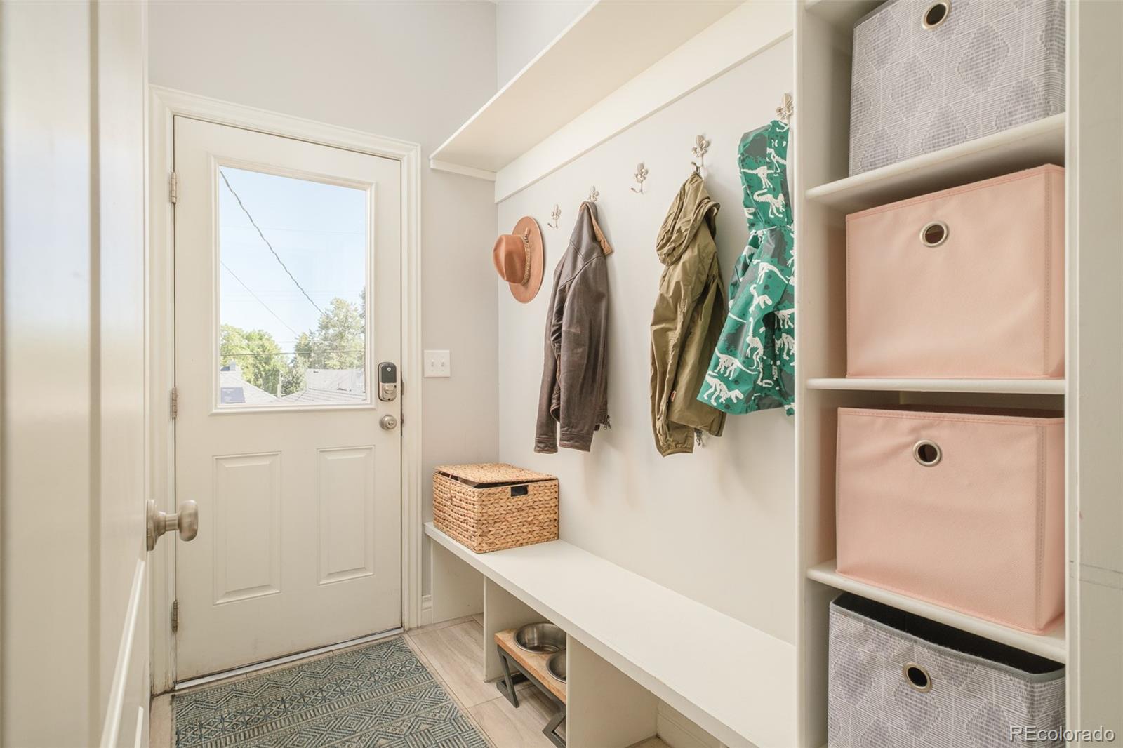 3234 Stuart Street Denver, CO 80212 - Photo 15 of 41 a bathroom with a sink mirror and shower