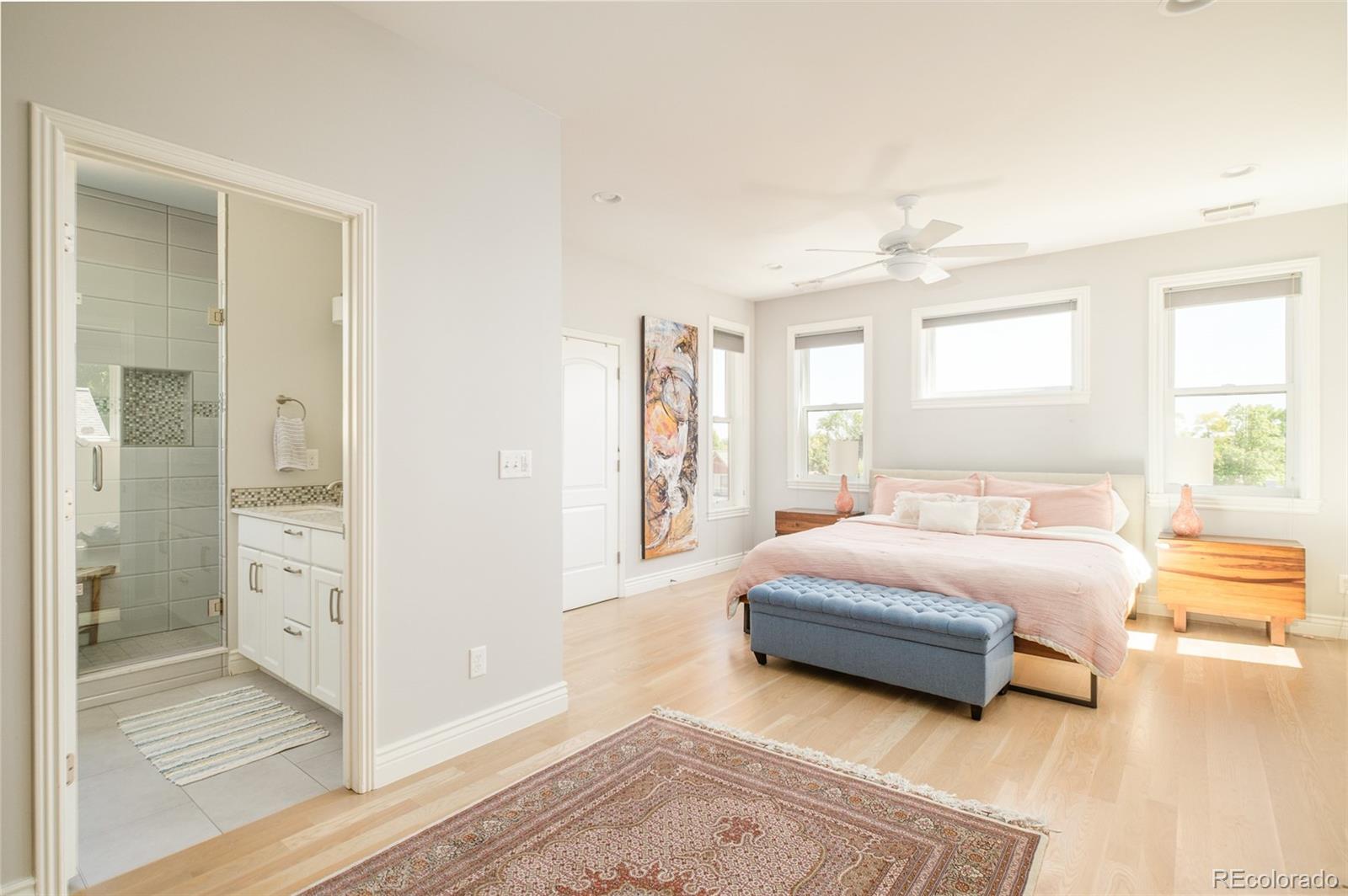 3234 Stuart Street Denver, CO 80212 - Photo 16 of 41 a spacious bedroom with a bed and a walk in closet