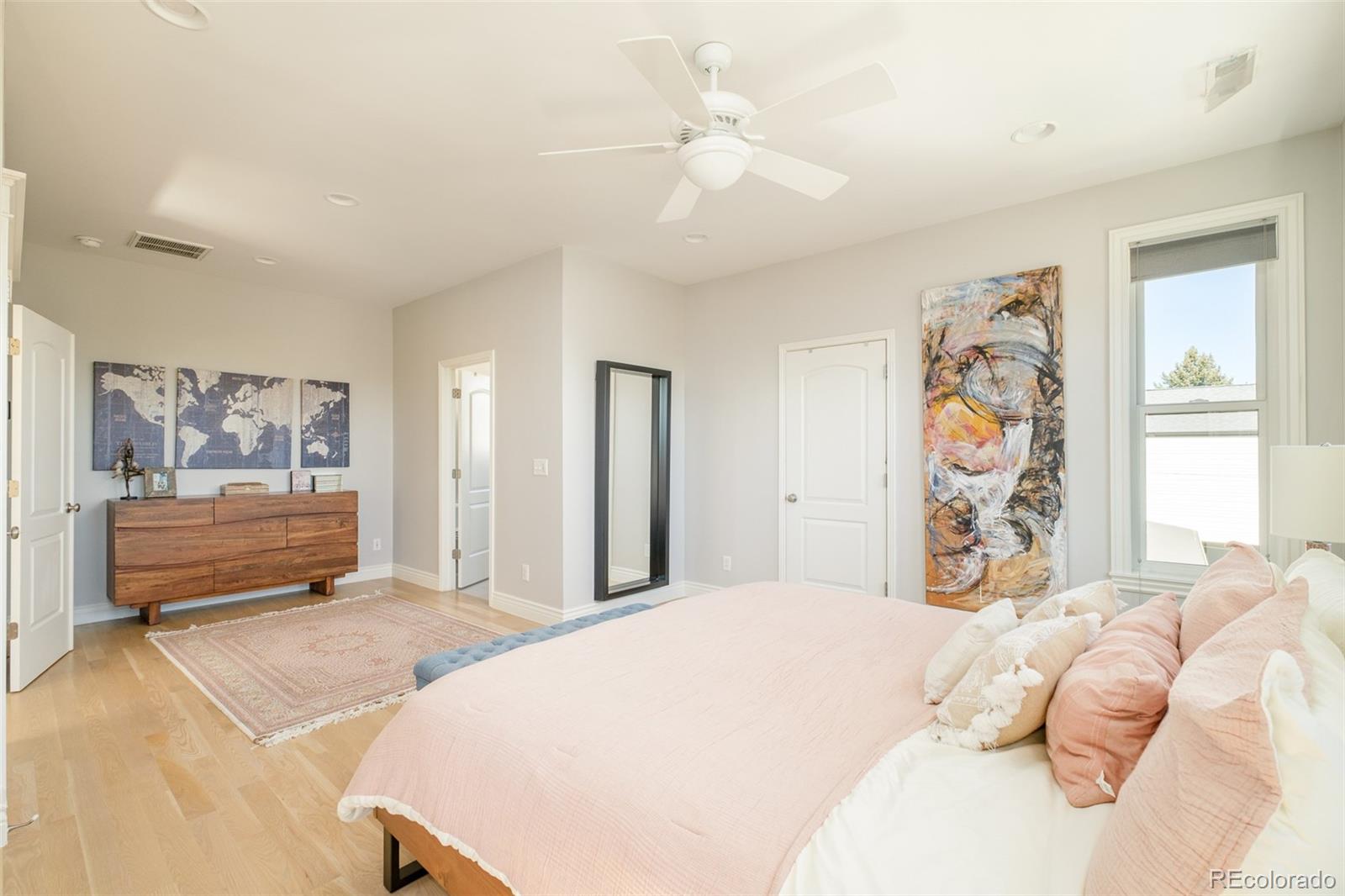 3234 Stuart Street Denver, CO 80212 - Photo 20 of 41 a bed room with a bed and a painting on the wall