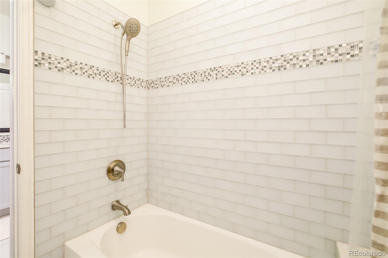 3234 Stuart Street Denver, CO 80212 - Photo 24 of 41 a bathroom with a shower and a bathtub