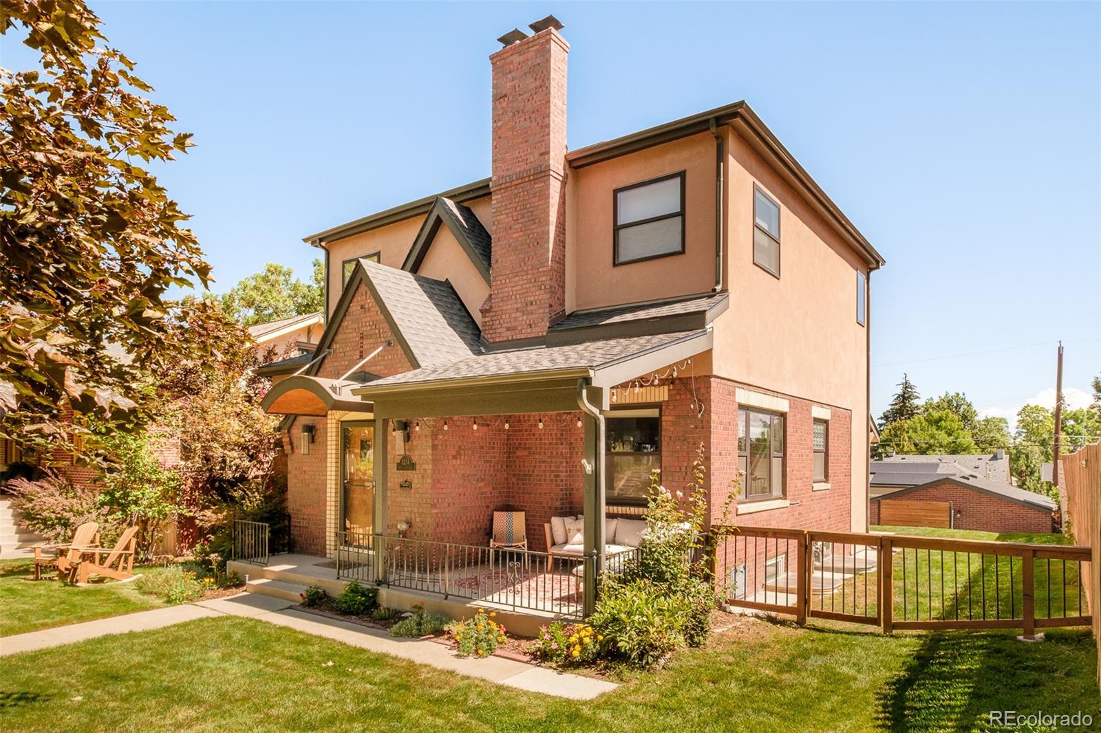 3234 Stuart Street Denver, CO 80212 - Photo 29 of 41 a front view of a house with a yard table and chairs