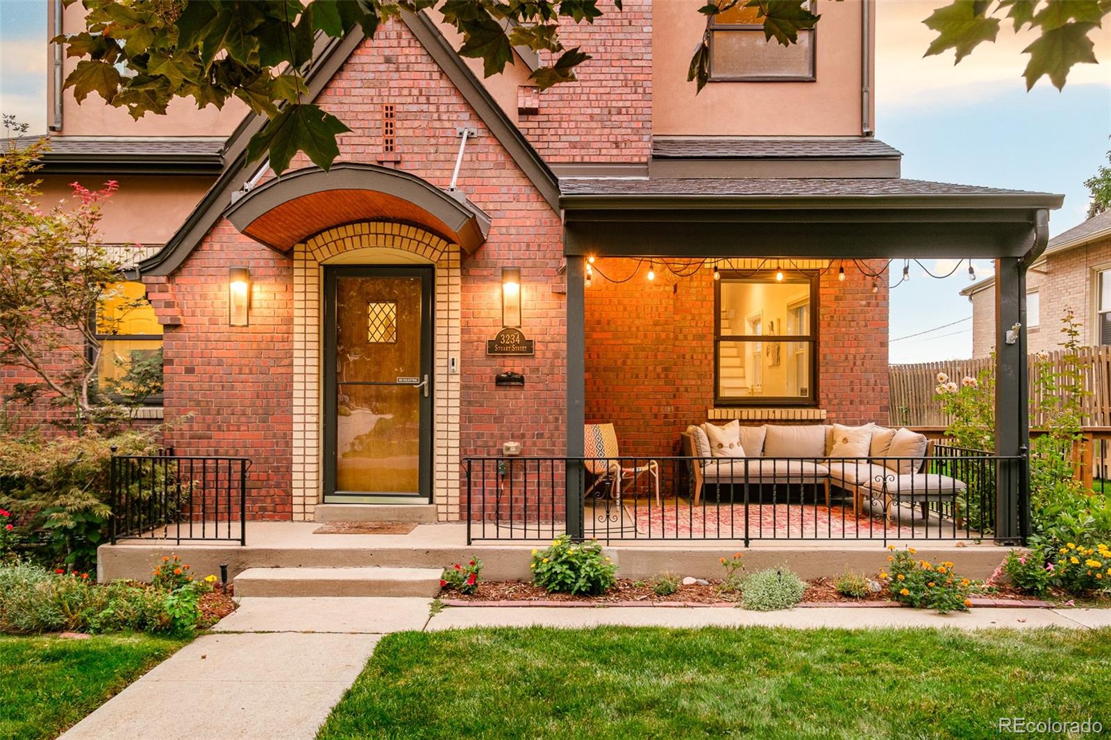 3234 Stuart Street Denver, CO 80212 - Photo 34 of 41 a view of a brick house with a large windows