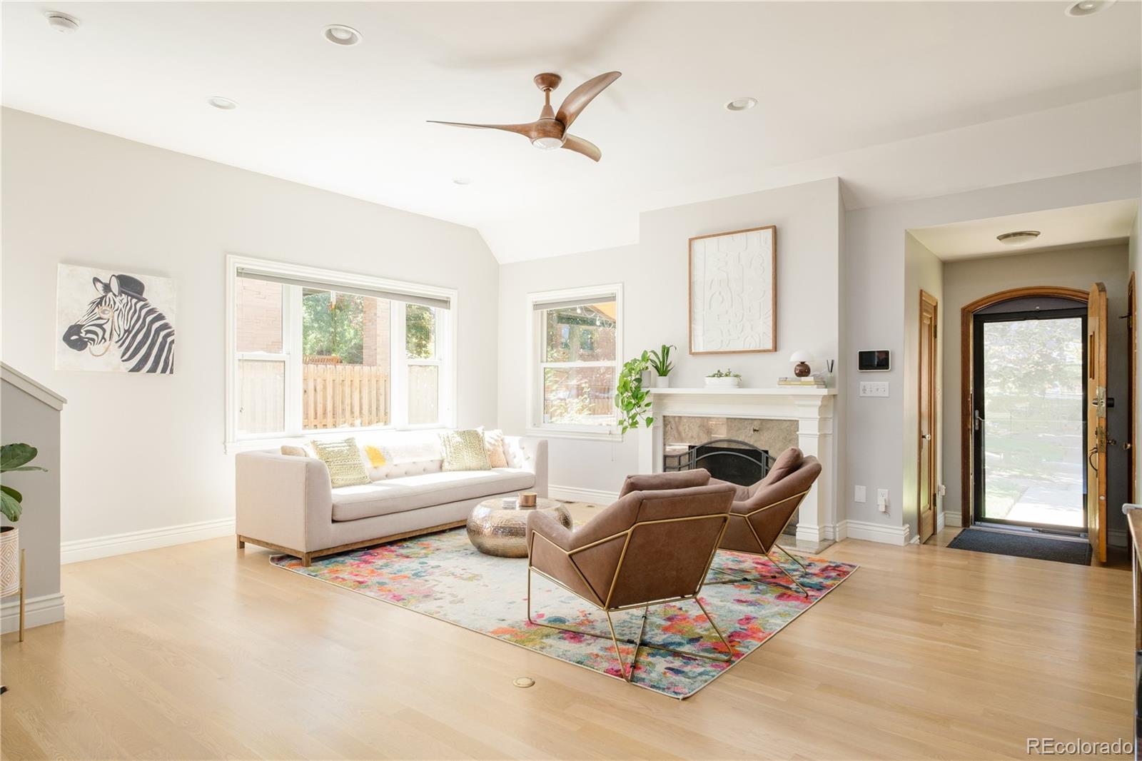 3234 Stuart Street Denver, CO 80212 - Photo 5 of 41 a living room with furniture a fireplace and a window