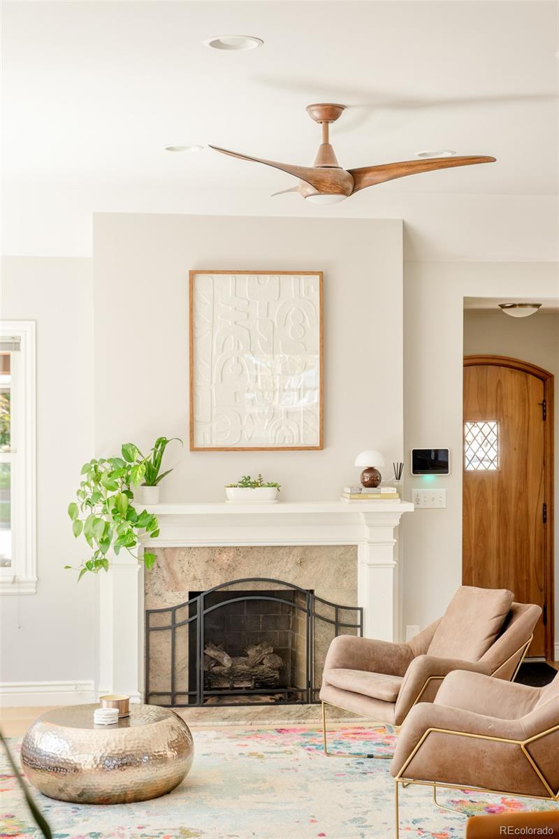 3234 Stuart Street Denver, CO 80212 - Photo 6 of 41 a living room with furniture and a fireplace