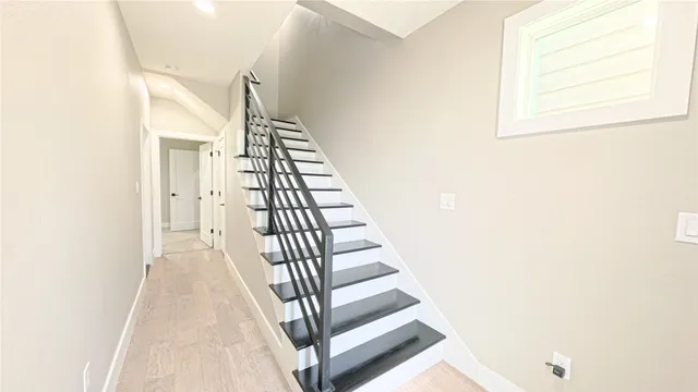 a view of a hallway with staircase