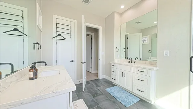 a bathroom with a double vanity sink mirror and double
