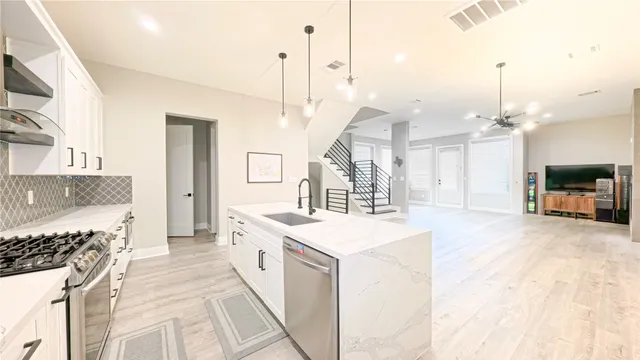 a large room with a large window and a fireplace