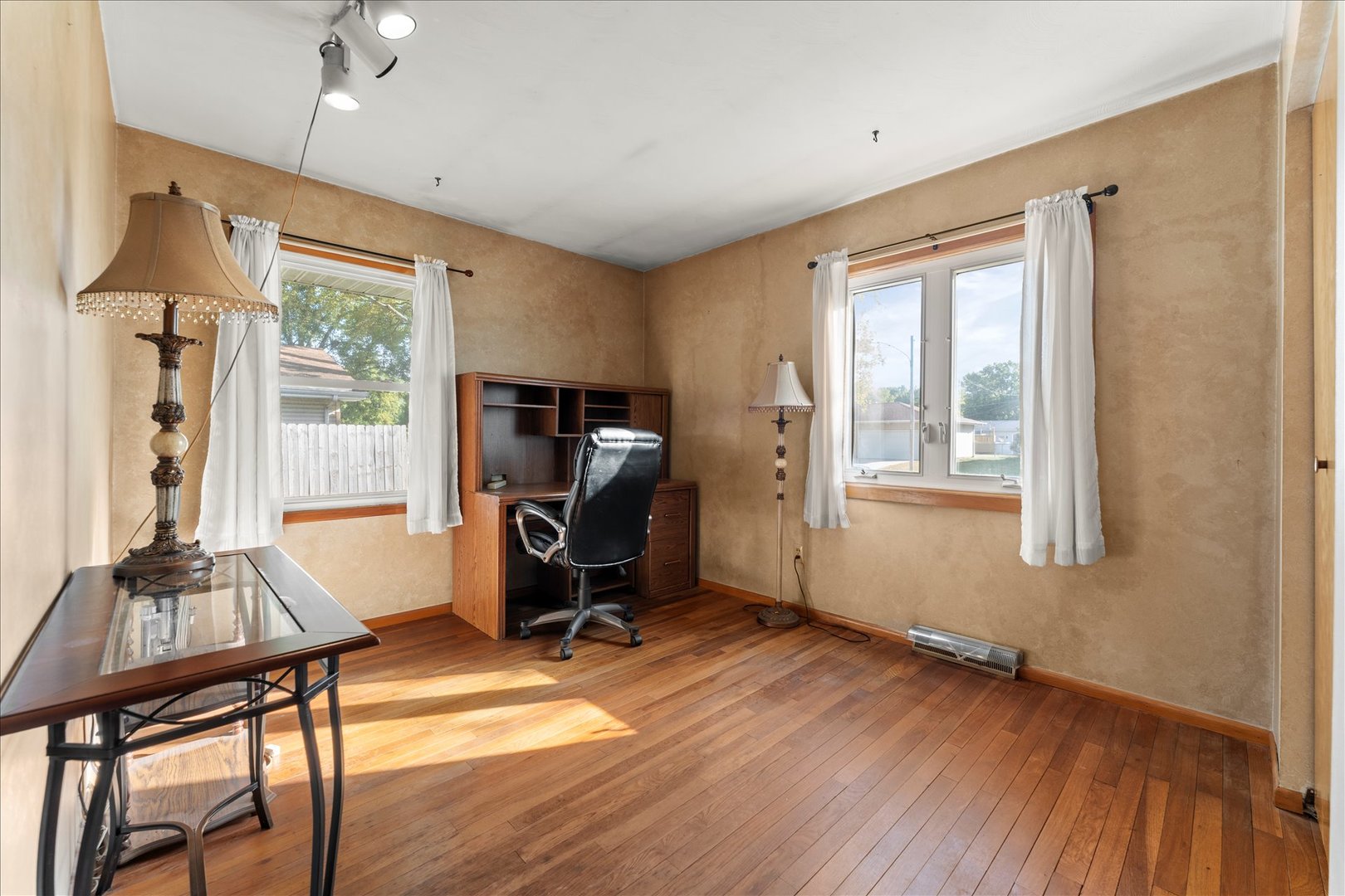 708 Jackson Street Monticello, IL 61856 - Photo 16 of 28 a view of a workspace with furniture and a window