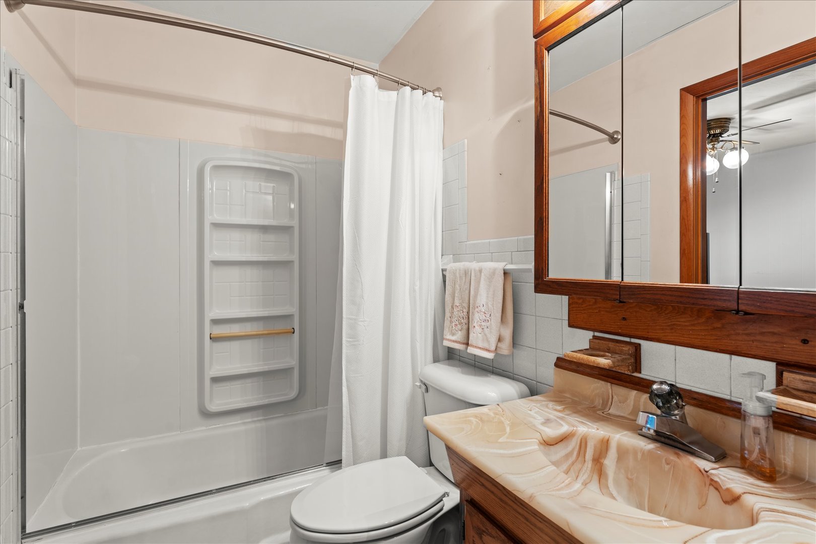 708 Jackson Street Monticello, IL 61856 - Photo 18 of 28 a bathroom with a sink a toilet and shower