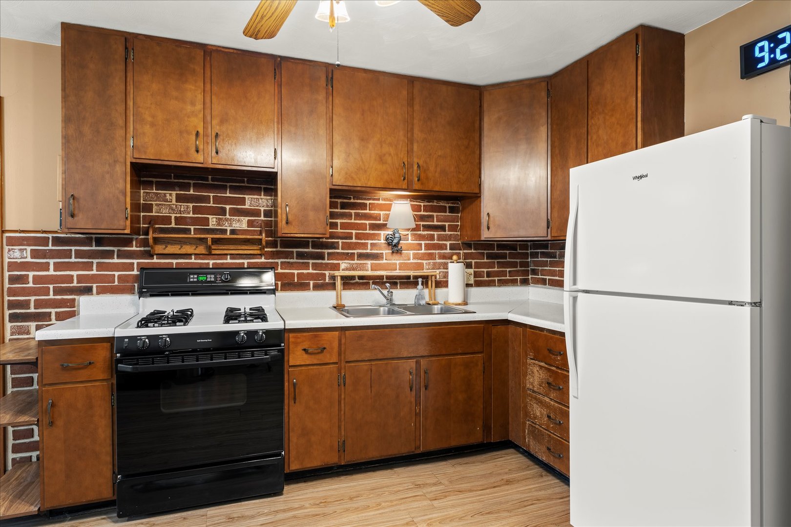 708 Jackson Street Monticello, IL 61856 - Photo 8 of 28 a kitchen with a sink a stove and refrigerator