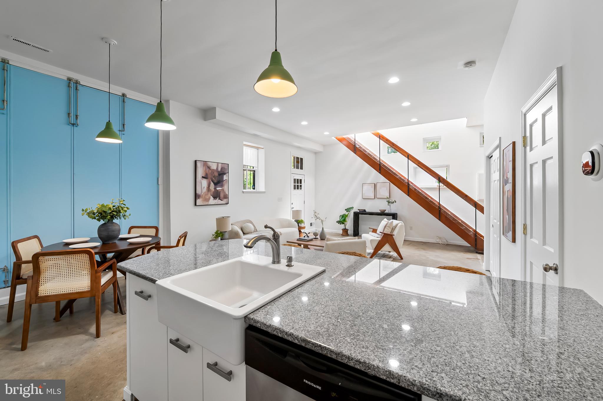 307 Mosher Street Baltimore, MD 21217 - Photo 15 of 30 a kitchen with a sink a table and chairs