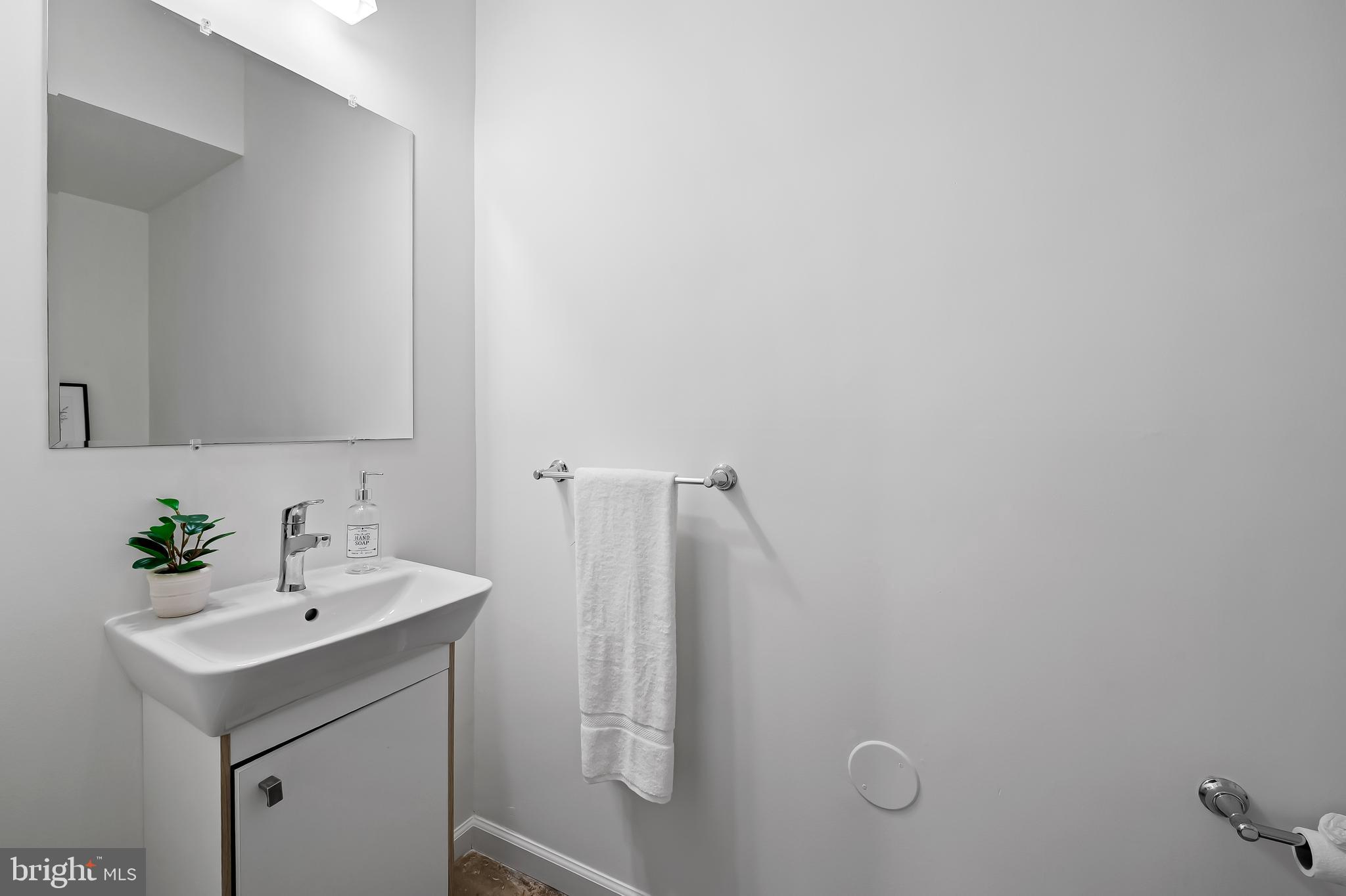 307 Mosher Street Baltimore, MD 21217 - Photo 16 of 30 a bathroom with a sink and mirror