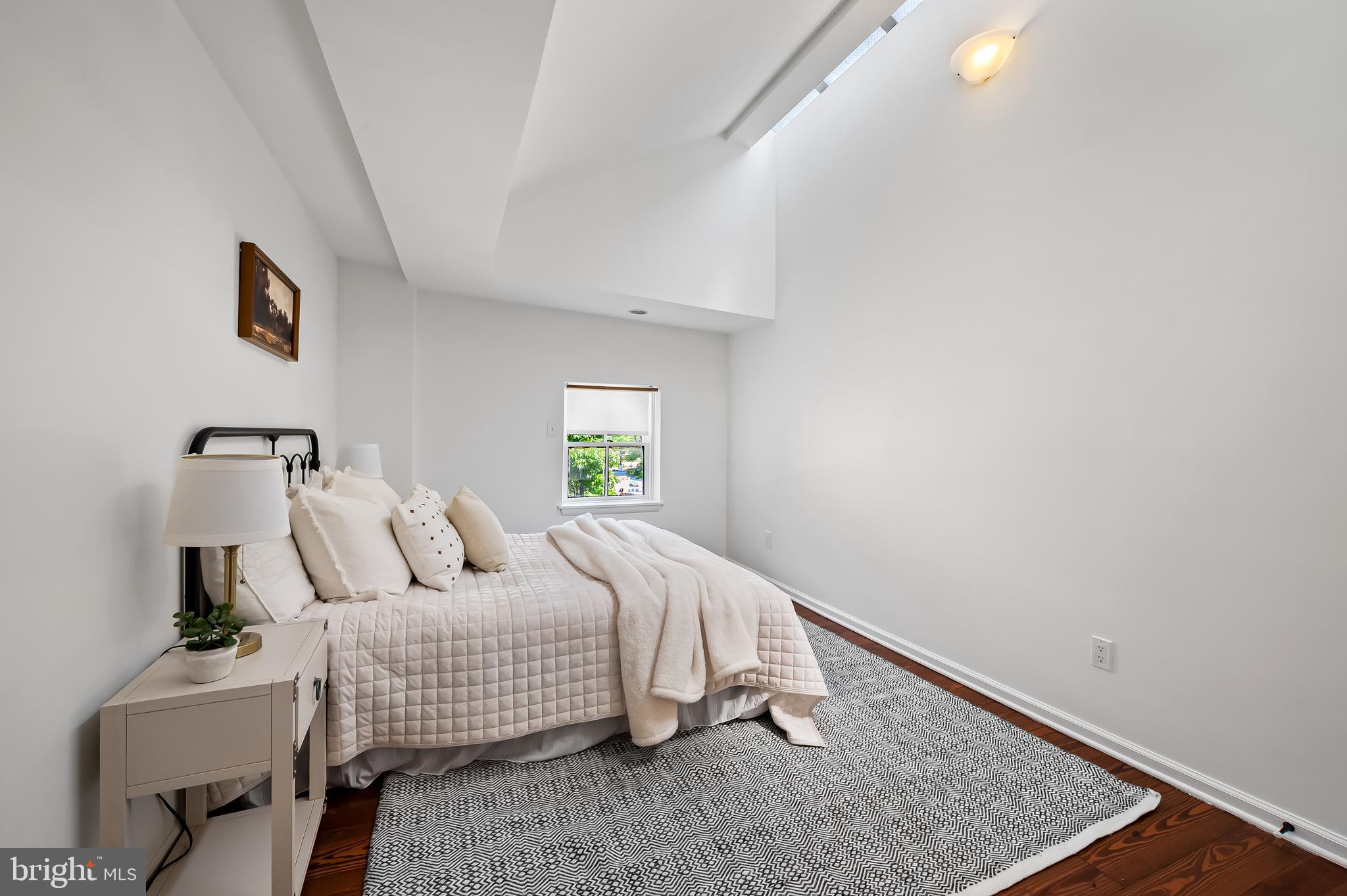 307 Mosher Street Baltimore, MD 21217 - Photo 23 of 30 a bedroom with a bed and a window