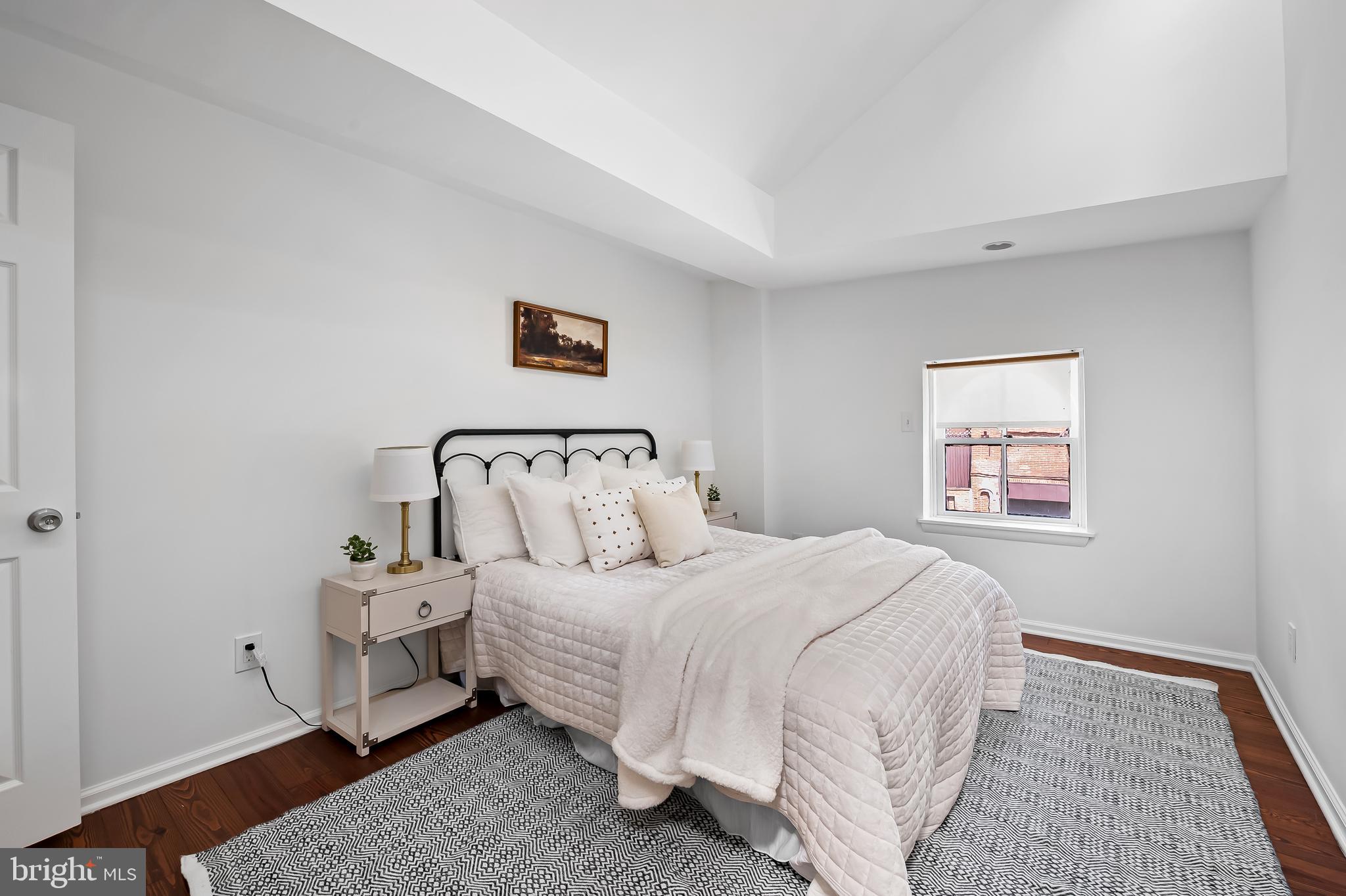 307 Mosher Street Baltimore, MD 21217 - Photo 24 of 30 a bedroom with a bed and a couch